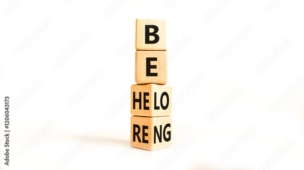 Belonging and belong symbol. Concept words Be here Belong on beautiful wooden block. Beautiful white table white background. Business motivational belonging and belong concept. Copy space. Belonging and belong symbol. Concept words Be here Belong on beautiful wooden block. Beautiful white table white background. Business motivational belonging and belong concept. Copy space.