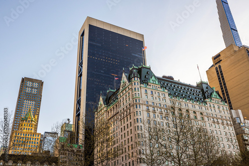 Hotel and modern skyscrapers near Central Park under clear sky on spring evening. New York. USA. photo