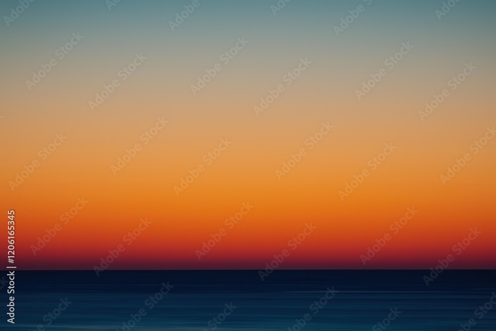 Fototapeta premium Sunset Gradient: A sky transitioning from deep orange to soft pink, with the horizon fading into a calm, dusky blue