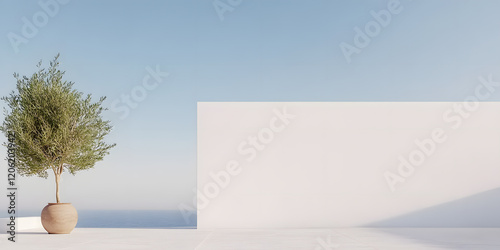 Mediterranean minimalism: A potted olive tree stands before a white wall, overlooking a calm sea under a clear sky. photo