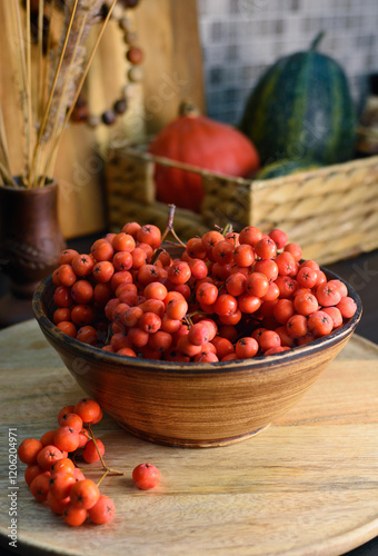 Fényképezés Rowan berries ( Mountain ash berries) in a bowl on kitchen counter