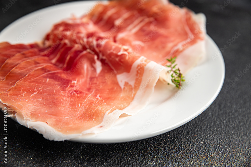 Jamon meat iberico or serrano snack aperitif fresh tasty food dish gourmet food background on the table rustic food top view copy space Jamon meat iberico or serrano snack aperitif fresh tasty food dish gourmet food background on the table rustic food top view copy space