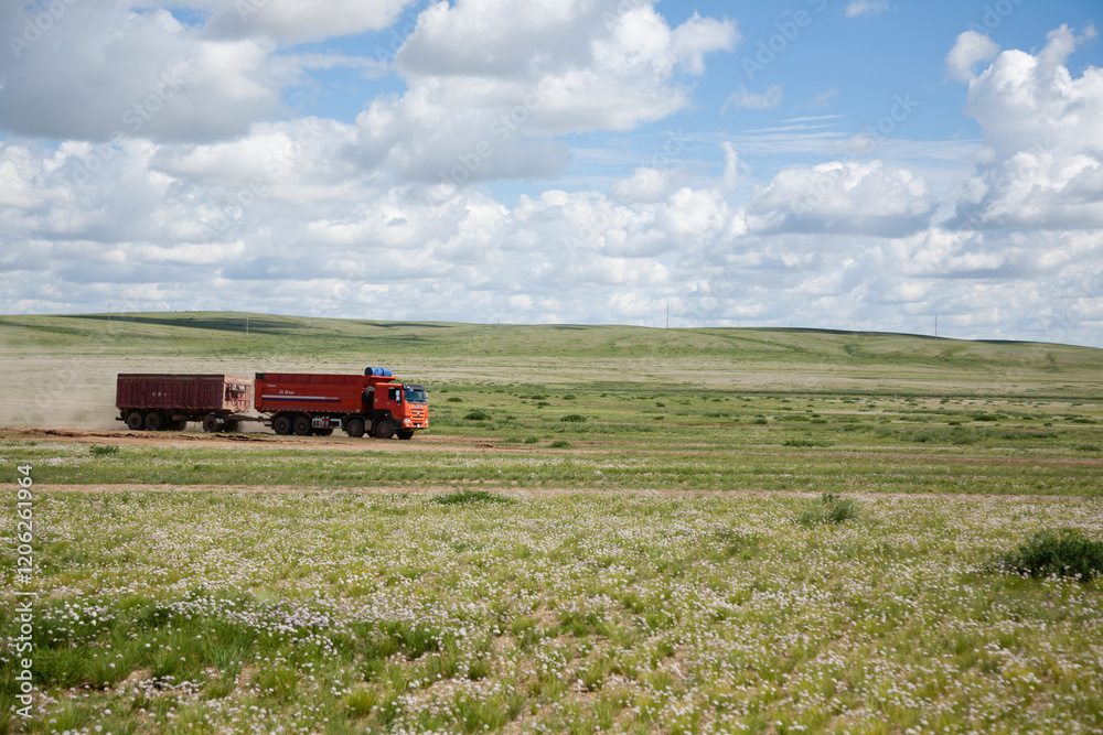 Red truck with mining cargo crosses the Gobi Desert, Mongolia Red truck with mining cargo crosses the Gobi Desert, Mongolia