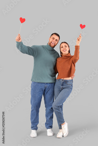 Lovely couple with paper he...