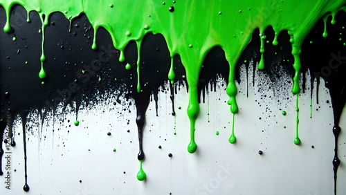 Creative color splash with black and green paint dripping on a textured surface in an artistic expression of chaos and vibrancy photo