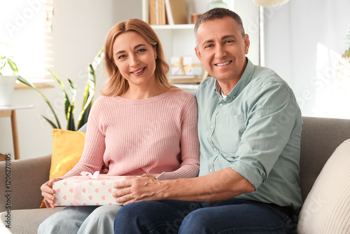 Middle-aged couple with gif...