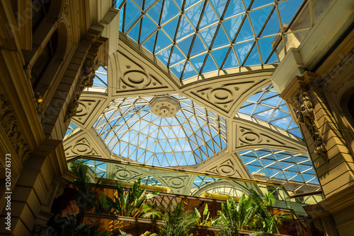 A large building with a dome on top and a glass ceiling