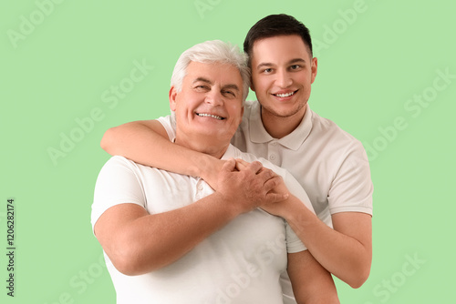 Young man hugging his fathe...