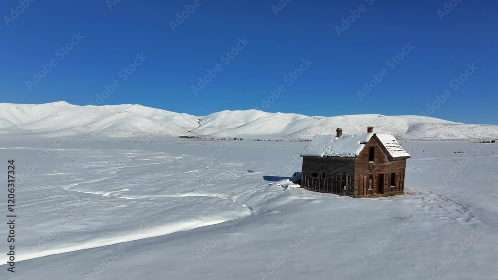 Old Homestead on a winter plane in Idaho Old Homestead on a winter plane in Idaho