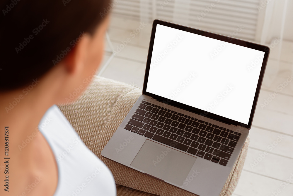Naklejka premium Unrecognizable Woman Looking At Laptop Empty Screen Browsing Internet Sitting At Home. Mockup, Selective Focus