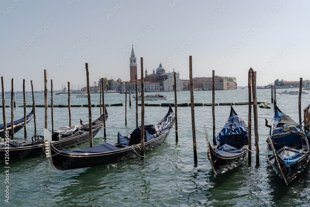 Gondolas. Gondolas parked on the canal without people. Gondolas. Gondolas parked on the canal without people.