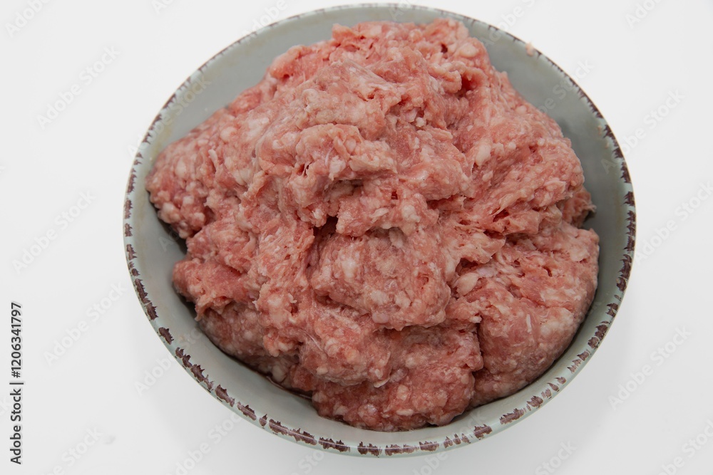 Fresh Ground Meat in a Ceramic Bowl on White Background – Ready for Cooking Fresh Ground Meat in a Ceramic Bowl on White Background – Ready for Cooking