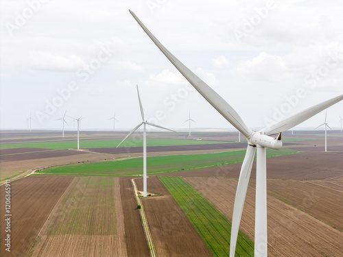 Konstfotografi Aerial drone view of turbines windfarm on a green hillside