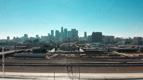 Explore the skyline of Los Angeles with urban architecture and bustling infrastructure during a bright sunny day
