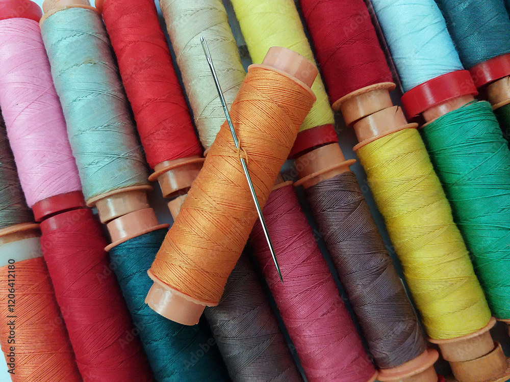 Colorful spools of thread used in making clothes Colorful spools of thread used in making clothes