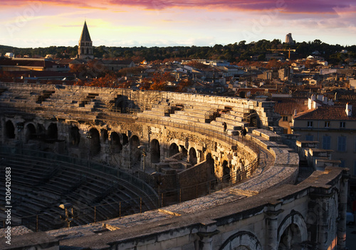 Exterior of Arena of Nimes at sunset, ancient Roman amphitheater in France photo