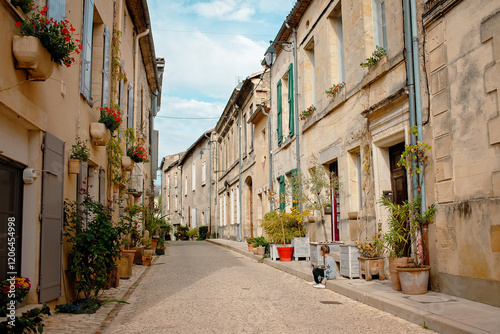 Fototapeta Naklejka Na Ścianę i Meble -  A stunning photo of a historic European village. Cobblestone streets and vintage architecture highlight the charm of France or Switzerland. Perfect for travel and tourism content