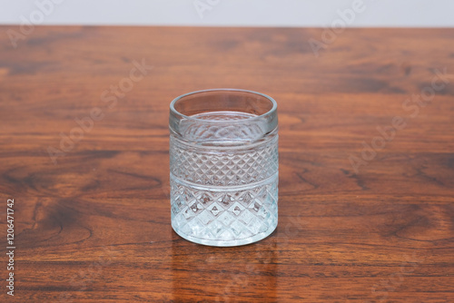 A drinking glass on wooden table photo