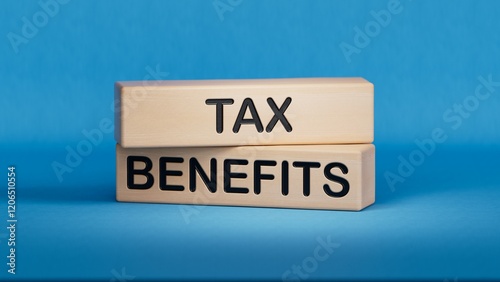 wooden cube with TAX BENEFITS. Wooden cube blocks. Copy space.3D rendering on blue background. 