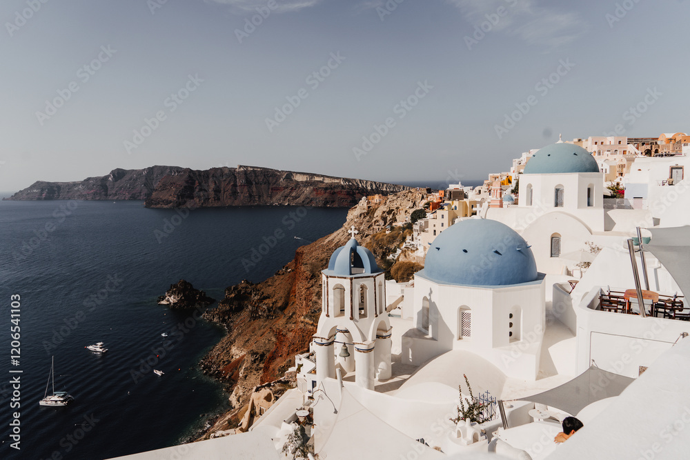 Fototapeta premium Overlooking the Blue Domed Church in Santorini