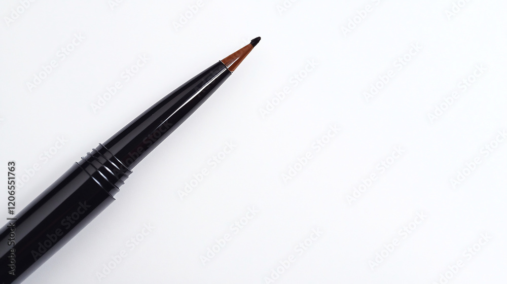 Close-up of a black eyeliner pen on white background. Close-up of a black eyeliner pen on white background.