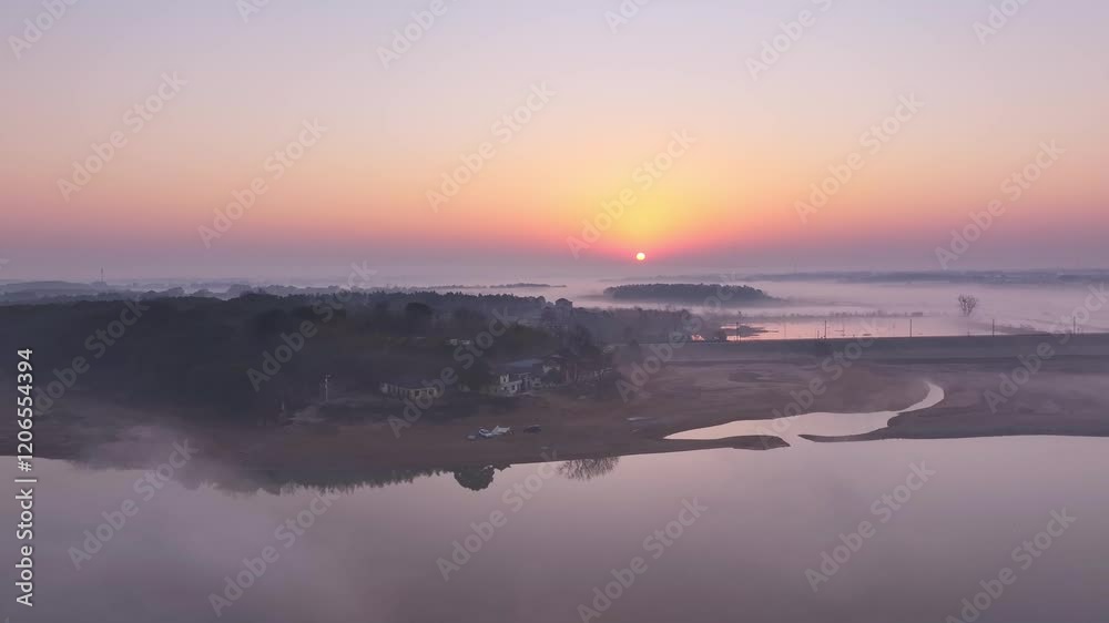 Sunrise fog over the lake, migratory birds in winter Sunrise fog over the lake, migratory birds in winter