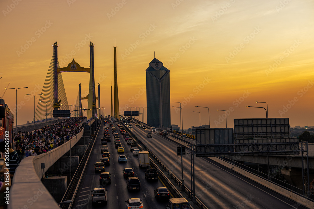 Naklejka premium Abstract blurred background of high angle view from the Thotsamarachan Bridge across the Chao Phraya River with a view of Bangkok's condominium buildings, population density in the capital city.