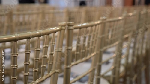 Elegant and stylish Chiavari chairs are meticulously arranged to enhance the sophisticated ambiance of the event