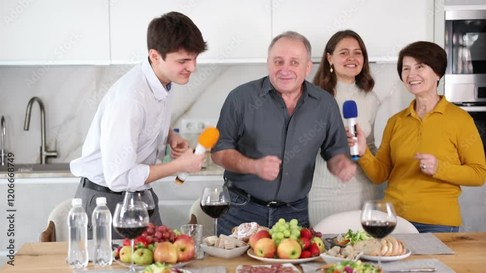 Friendly family with adult children singing karaoke together at home . High quality 4k footage