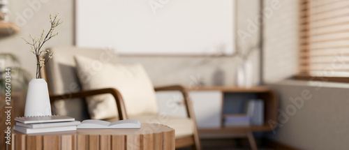 A close-up of books and a ceramic flower vase placed on a wooden mini table in a cosy living room.