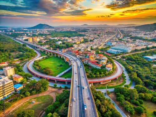 Vijayawada's Kanaka Durga Flyover dominates this panoramic aerial drone image, showcasing Andhra Pradesh's vibrant cityscape. photo