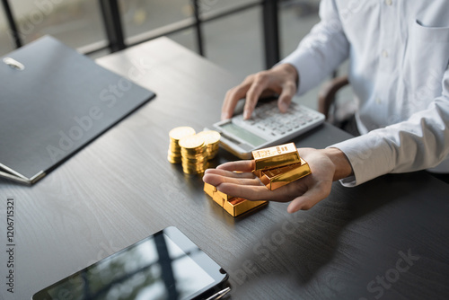 Gold Trading business man hand offering gold Investment in gold mining company or Trading gold on the stock exchange Rising gold prices. photo