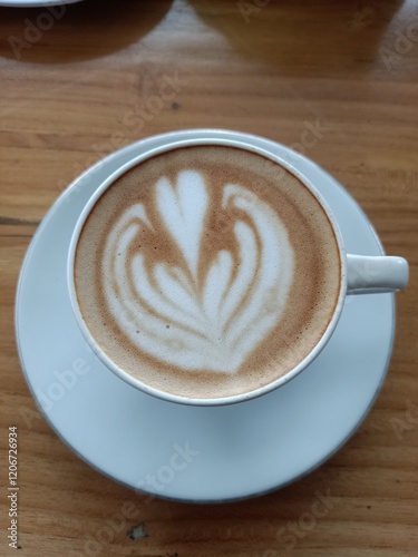 cup of coffee on wooden table