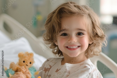 Young child shows courage and joy during leukemia treatment, embodying resilience and hope