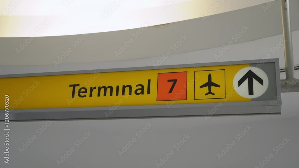 A welldefined and clear view of a Terminal 7 sign, which is ideal for use in travelrelated media and airport visuals A welldefined and clear view of a Terminal 7 sign, which is ideal for use in travelrelated media and airport visuals