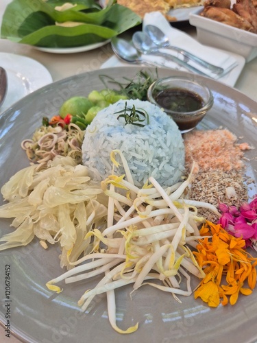 Traditional fried rice with fruit and herbal vegetable serving on the plate. Famous luxury rice menu in Thai restaurant.