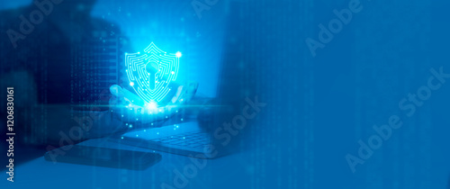 Cyber Security concept. Man holds digital shield icon in the center and circuit board with digital data transfers, representing evolving security technology of the future.