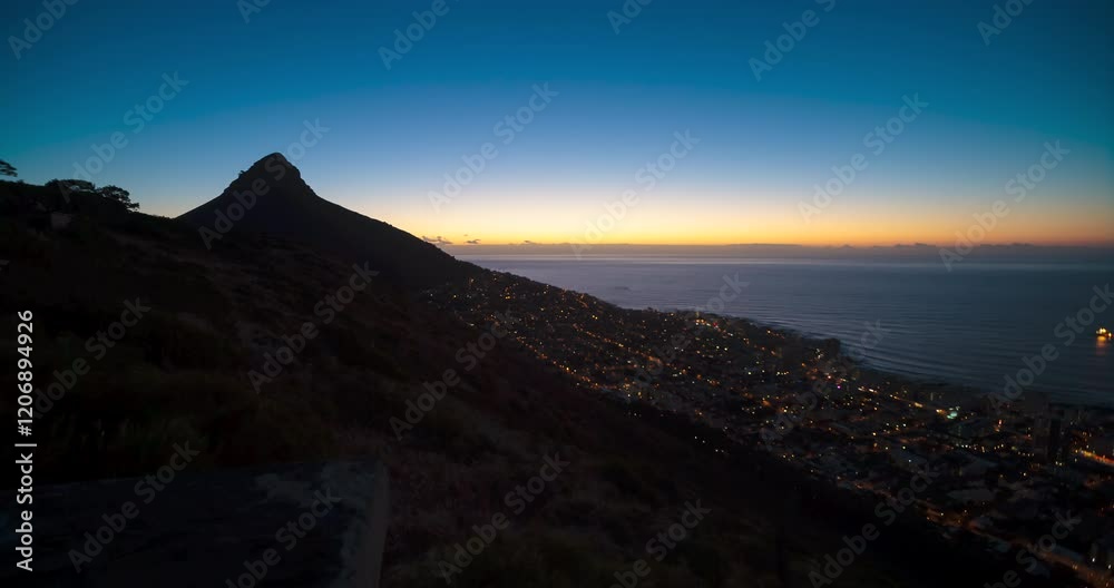A sunset static day-to-night transition Time Lapse with Lion's Head and Seapoint, in Cape Town, South Africa A sunset static day-to-night transition Time Lapse with Lion's Head and Seapoint, in Cape Town, South Africa
