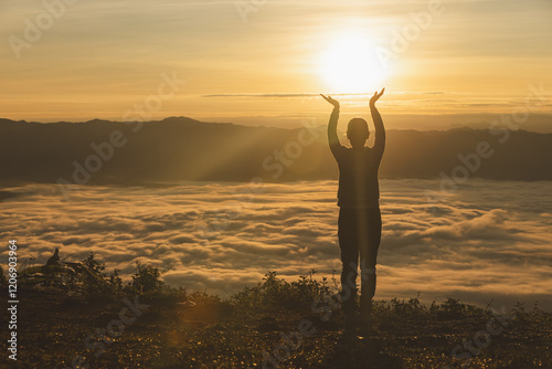 Silhouette of Religious young woman praying to God in the morning, spirtuality and religion,  Christians and Bible study concept.