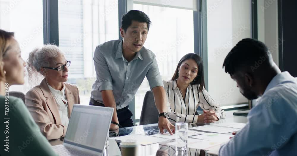 Business meeting, man presenting ideas to colleagues in modern office setting