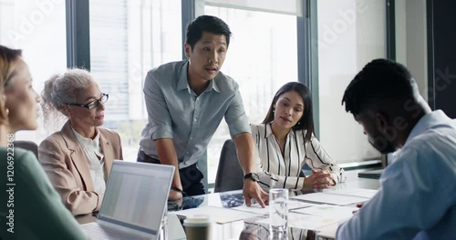Business meeting, man presenting ideas to colleagues in modern office setting