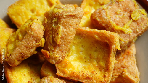 Close-Up of Crispy Fried Tofu with Golden Batter Coating photo