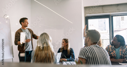 Billede på lærred Smiling diverse colleagues gather in boardroom brainstorm discuss financial stat