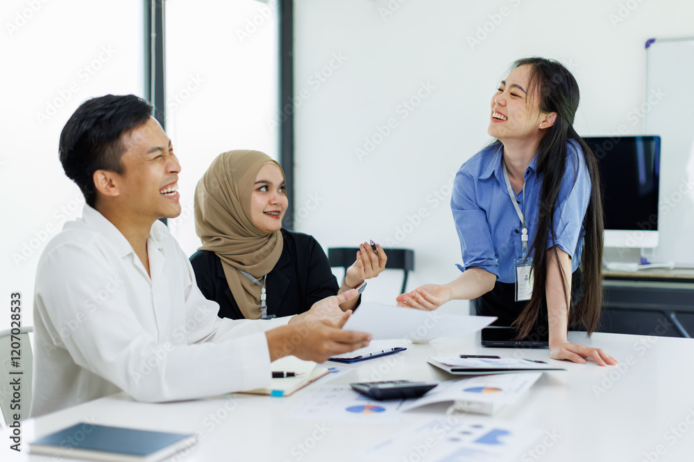 Diverse colleagues collaborative brainstorming at office briefing, Young Business Asian people explaining analysis at the meeting Multiethnic startup work. Diverse colleagues collaborative brainstorming at office briefing, Young Business Asian people explaining analysis at the meeting Multiethnic startup work.