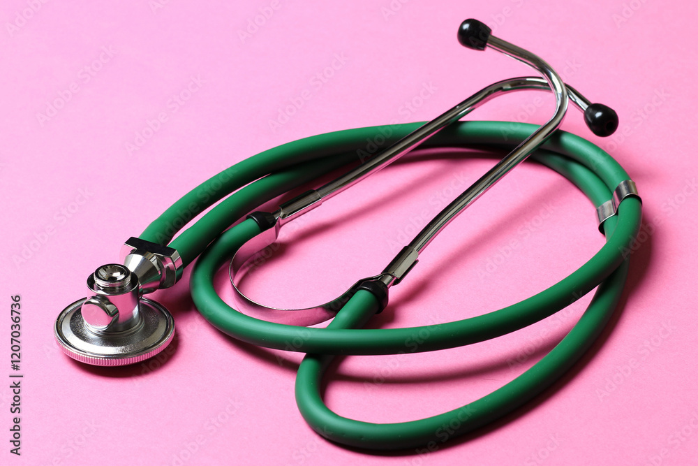 Top view of green stethoscope on colorful background. Medical diagnosis tool concept Top view of green stethoscope on colorful background. Medical diagnosis tool concept