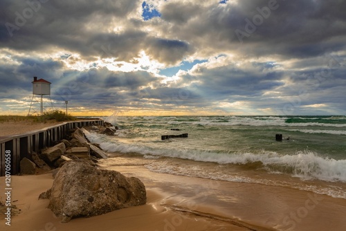 Waves crashing onto the shore of Ludington, Michigan under a clear sky. photo