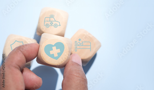 Health insurance concept. Health care checkup and healthy trends. Access to welfare health. Wellness and medical. Wood cube and healthcare insurance icon on pastel blue background. World health day