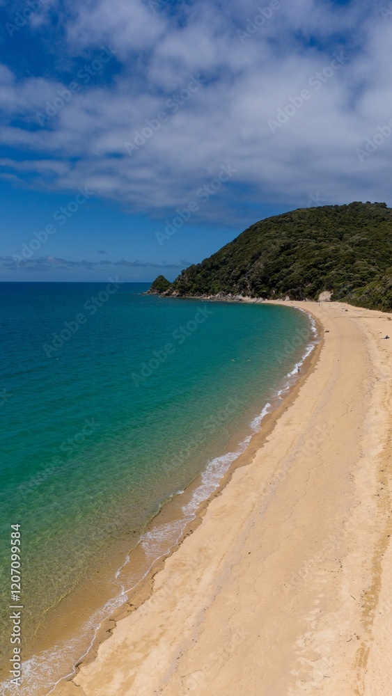 Scenic view of a pristine sandy beach with turquoise waters. Scenic view of a pristine sandy beach with turquoise waters.