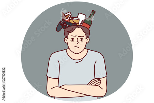 Angry man suffering from bad habits stands with garbage in head and looks at screen. Young guy is addicted to cigarettes and alcoholic beverages and needs advice to fight bad habits