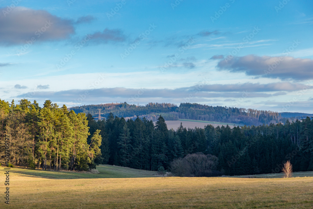A rural landscape on a cold winter evening. Snowless winter